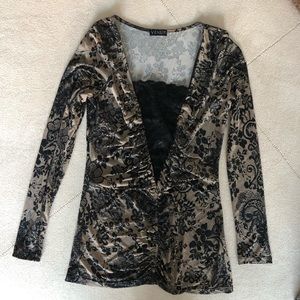 Long sleeve Black and Tan shirt.